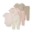 Organic cotton bodysuits and pants set for baby girls, featuring floral and cloud patterns in soft pastel colors.