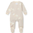 Baby sleep and play onesie in limestone color, featuring a cloud pattern and footed design with a tag at the neck.