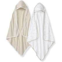 Hooded baby towels in oatmeal color and white with delicate floral patterns, made from absorbent knit terry fabric.