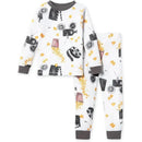 Baby pajama set featuring a white fabric printed with film projectors, popcorn, and movie reels.