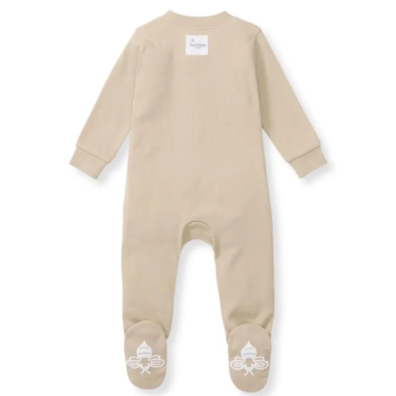 Baby unisex solid rib sleep and play in hummus color, featuring a tag on the back and decorative soles.