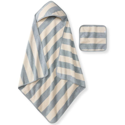 Rugby stripe woven terry towel in quarry blue and cream, with a matching washcloth beside it.