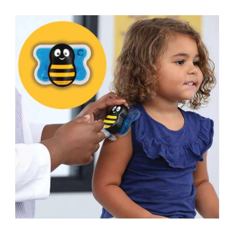 A child is receiving a vaccination while a healthcare provider uses the Buzzy Injection Pain Relief Device shaped like a bee on her arm.