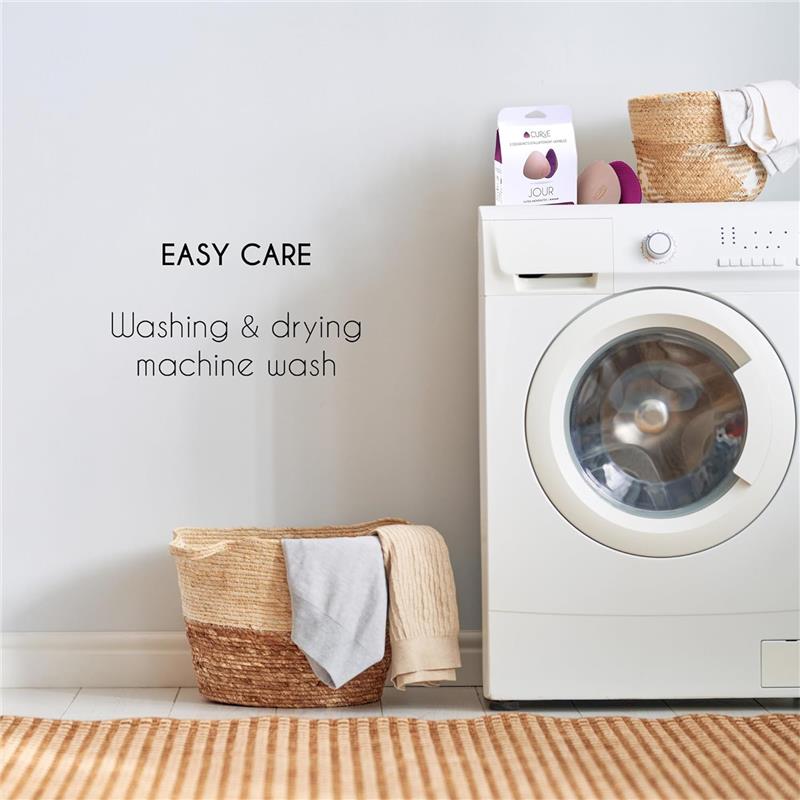 Nursing pads packaging beside a washing machine with a laundry basket and text on easy care instructions.