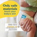 Reusable cloth diaper by Charlie Banana in white, showing safe materials label, with text emphasizing safety for babies.
