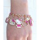 Gold charm bracelet featuring multiple Hello Kitty charms, including a locket and characters in various styles.