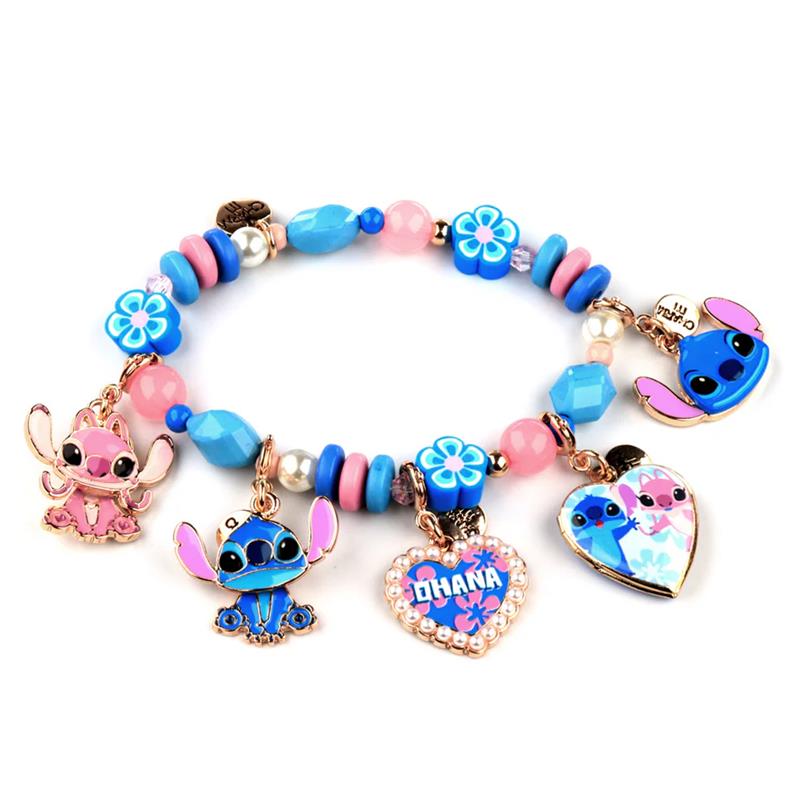 Charm It! - Gold Stitch Charm bracelet featuring colorful beads, floral charms, and various animated character charms, including Stitch and Angel.