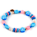 Gold Stitch Stretch Bead Bracelet featuring colorful beads, including floral designs in blue and pink tones.