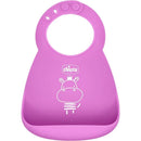 Silicone feeding bib in pink with a smiling hippo design, part of the Chicco Easy Start gift set for babies 6 months and older.