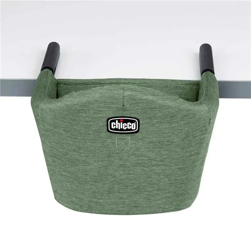 Chicco Fastlock 360 Hook-On Chair in moss green, featuring a sturdy design and logo, mounted on a table edge.