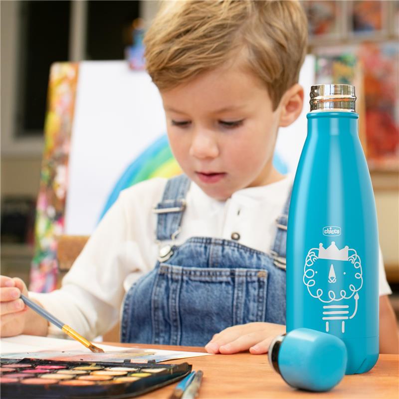 Chicco insulated pink stainless steel water bottle beside a young child painting at a table with art supplies.