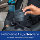 Removable cup holder being lifted from the Chicco Fit360 ClearTex Rotating Convertible Car Seat, featuring two flexible, dishwasher-safe holders.