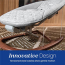 Chicco Float Baby Seat in gray fabric with a wooden frame, featuring tensioned steel cables for gentle motion.