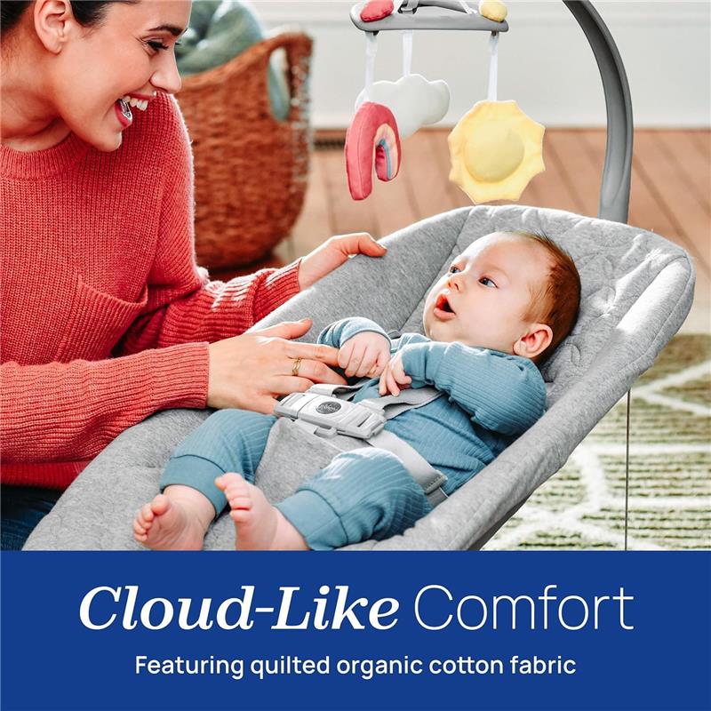Chicco Float Baby Seat in gray, featuring a cozy baby with a smiling caregiver, showcasing a mobile with colorful toys.