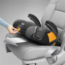 Chicco GoFit Plus Backless Booster Car Seat in Stream color, securely positioned in a vehicle with a hand adjusting the latch.