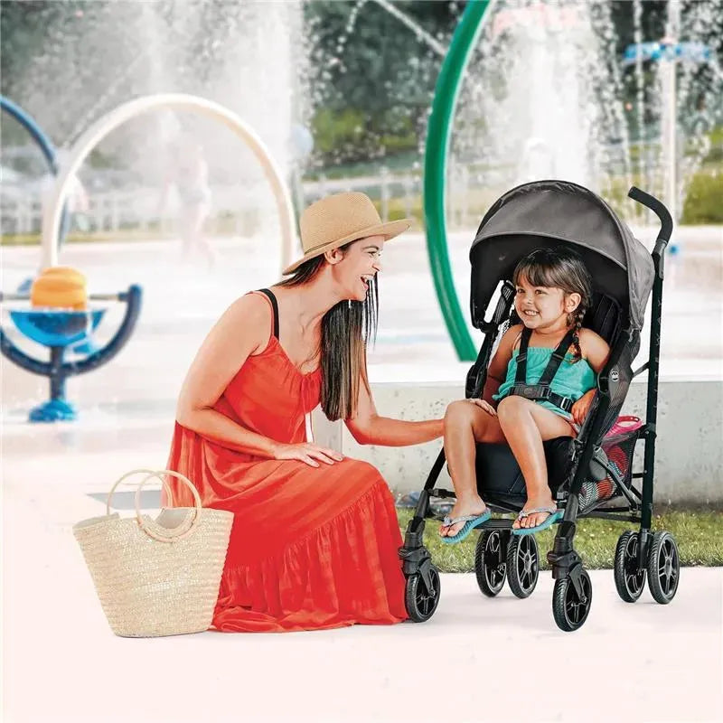 Chicco Liteway Stroller in Arctic, featuring a smiling girl in a swimsuit and a woman in a red dress by a splash pad.