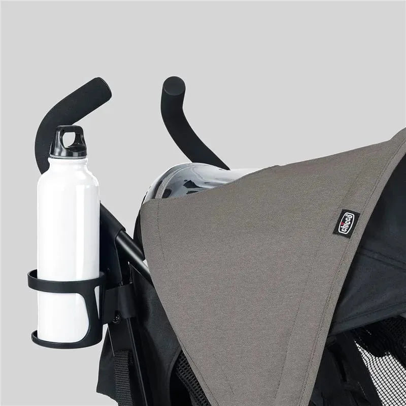 Chicco Liteway stroller in Dune color with a gray canopy and a white water bottle in a holder.