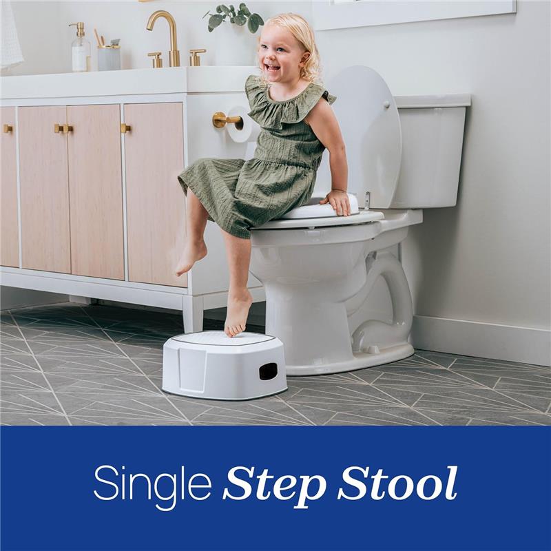 Chicco Single Step Stool with a child sitting on a toilet, smiling and using the stool to reach.