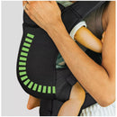 Chicco Snugsupport 4-In-1 Infant Carrier in black, showing a close-up of a baby securely held by an adult, highlighting design details.