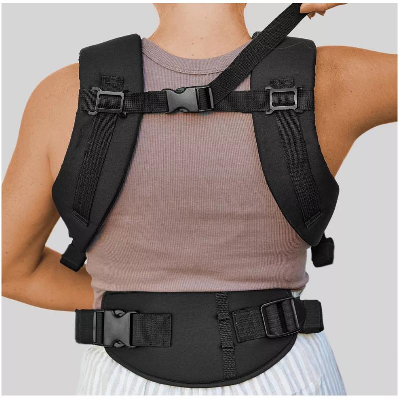 Black Chicco Snugsupport 4-In-1 Infant Carrier worn by a person, highlighting adjustable straps and padded support.