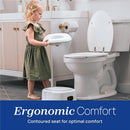 Young child holding a Chicco toilet topper over a toilet, with a step stool nearby, promoting ergonomic comfort for potty training.