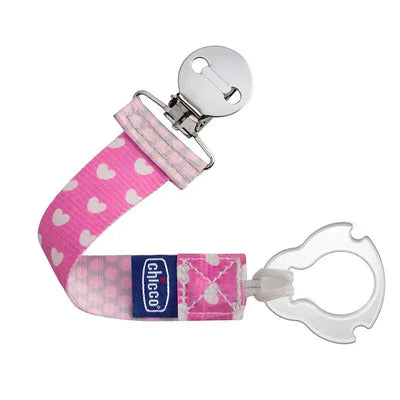 Chicco Universal Two-in-One Fashion Pacifier Clip in pink with white heart pattern and a metal clip for attachment.