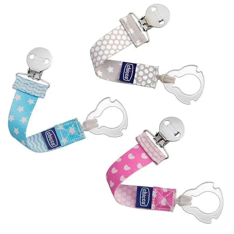 Chicco Universal Two-in-One Fashion Pacifier Clip in pink, featuring heart patterns and a sturdy clip for secure attachment.