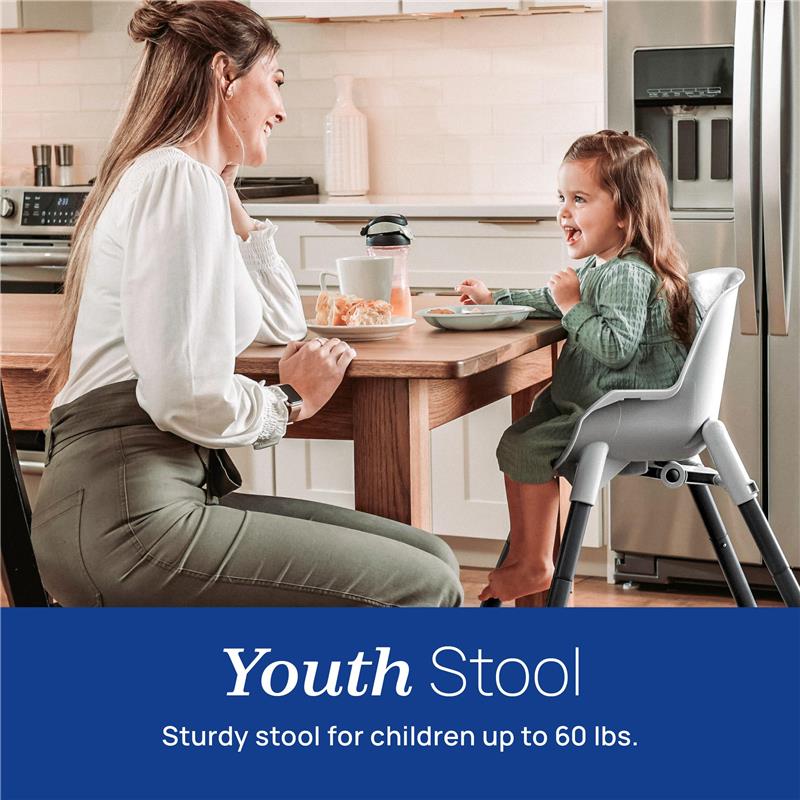 Chicco Zest 4-in-1 Folding High Chair in Seasalt/Grey; child happily seated with mother at a kitchen table.
