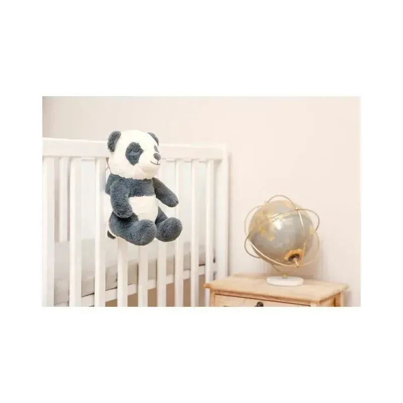 Soothing plush panda toy hanging from a crib, designed to provide calming sounds for infants.