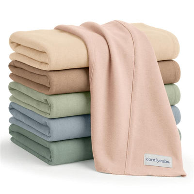 Ultra-absorbent Comfy Cubs 6-pack baby burp cloths in soft multicolor fabrics stacked neatly.