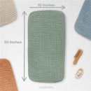 Muslin burp cloths from Comfy Cubs in a set of six, featuring a green cloth measuring 10x20 inches, with additional comb and items.