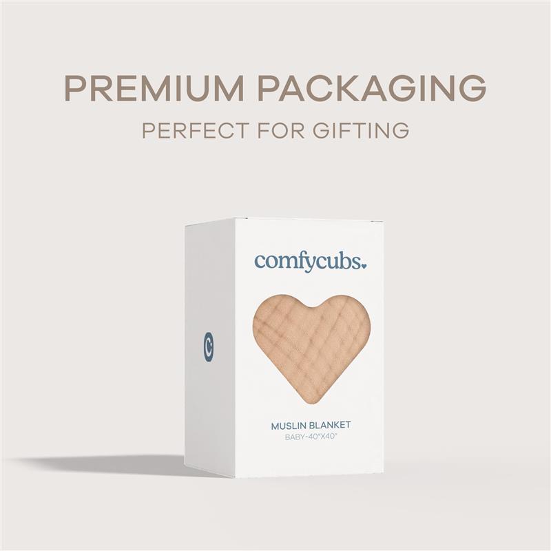 Cream-colored Comfy Cubs muslin baby blanket packaged in a white box with a heart window, labeled for gifting.