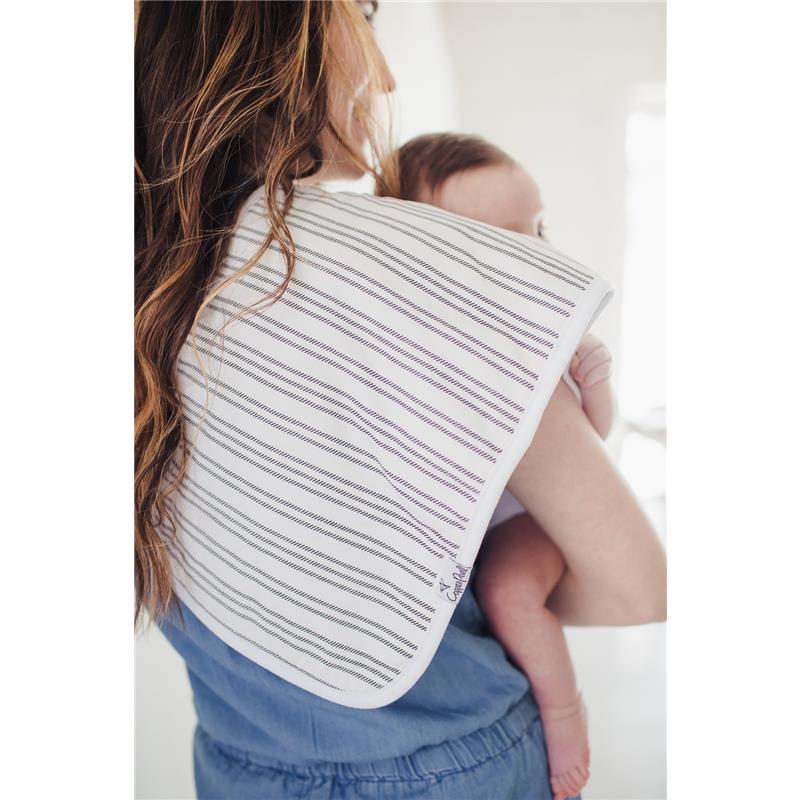 Premium baby burp cloth in a striped design draped over a caregiver’s shoulder, with a baby held close.