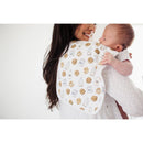 Premium baby burp cloth with milk and cookie pattern, draped over a woman holding an infant, smiling in a bright setting.