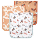 Three premium baby burp cloths from Copper Pearl, featuring cow print, cowboy boots, and western-themed illustrations.
