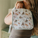 Premium baby burp cloth featuring a cowboy and horse design, draped over a mother holding a baby on her shoulder.