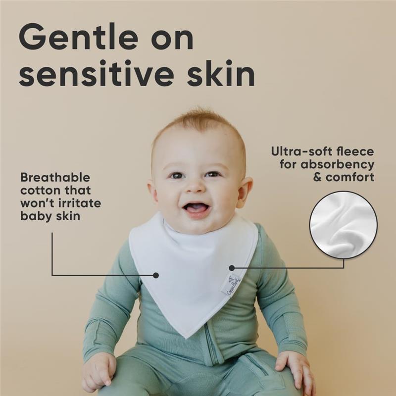 Baby wearing a white bandana bib smiles at the camera, with text highlighting its gentle, breathable cotton and ultra-soft fleece features.