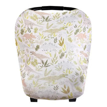 Baby car seat cover featuring a playful dinosaur pattern in soft colors, designed for easy use as a canopy.