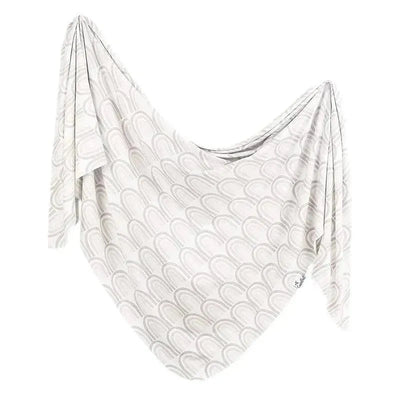 Bliss Knit Baby Swaddle Receiving Blanket by Copper Pearl, featuring a light background with a rainbow arch pattern.