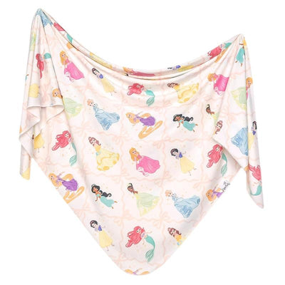 Knit blanket featuring Disney Princess characters in a variety of colorful dresses on a soft, pastel background.