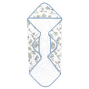 Hooded towel featuring whimsical forest illustrations, soft cotton knit fabric, and a light blue trim.