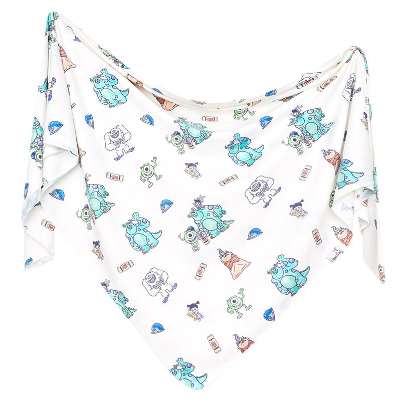 Knit blanket featuring colorful Monsters, Inc. characters on a white background, ideal for children.