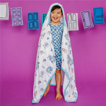 Big kid hooded towel featuring Monsters Inc characters, displayed by a smiling child on a purple background.