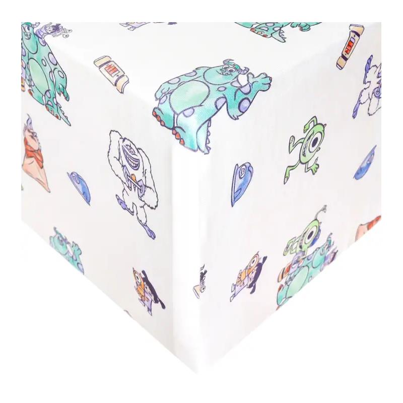 Premium crib sheet featuring colorful characters from Monsters Inc, including Mike and Sulley, on a white background.
