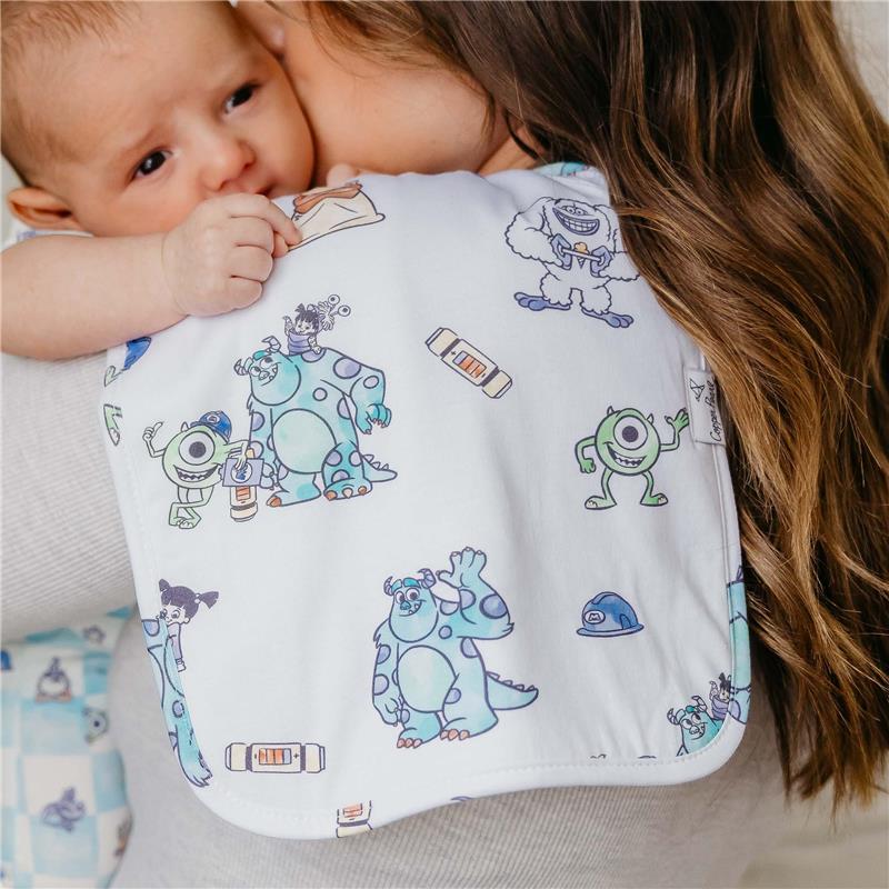 Burp cloth featuring colorful Monsters, Inc. characters, being held by a caregiver with an infant.