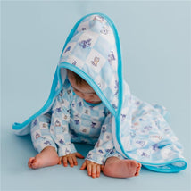 Hooded towel featuring a blue and white checkerboard pattern with Monsters Inc. characters, worn by an infant.