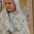 Big kid hooded towel featuring Hundred Acre Wood characters, wrapped around a smiling child with a playful expression.