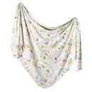 Knit baby swaddle blanket with soft, pastel animal and leaf patterns, designed for comfort and warmth.