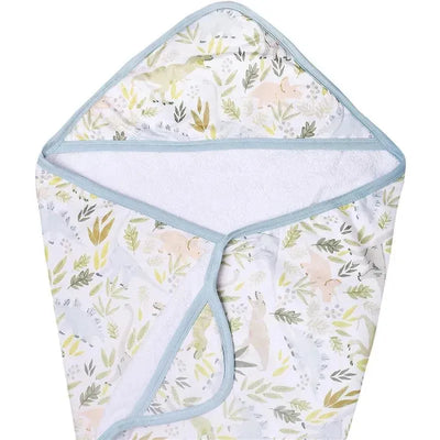 Hooded bath towel featuring a dinosaur and foliage print, made from soft knit material for infants.