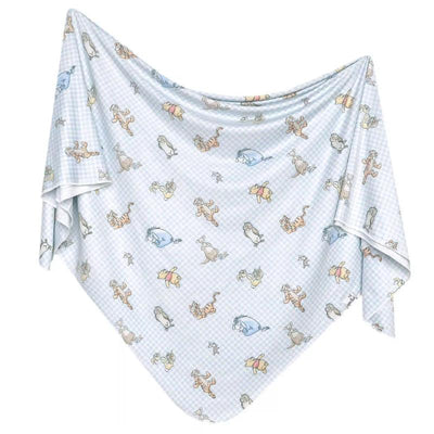 Cotton knit baby blanket featuring Winnie the Pooh and friends on a light blue checkered background.